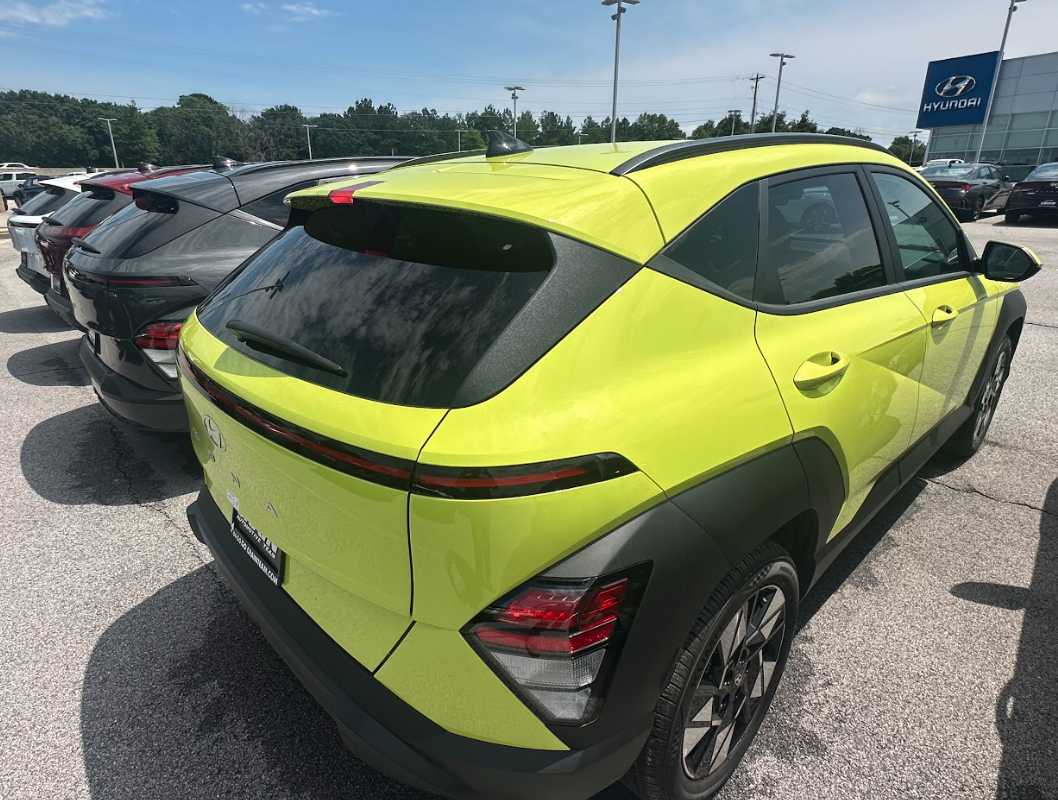 Bright green Hyundai Kona parked at Crain Hyundai of Fayetteville showcasing its modern design